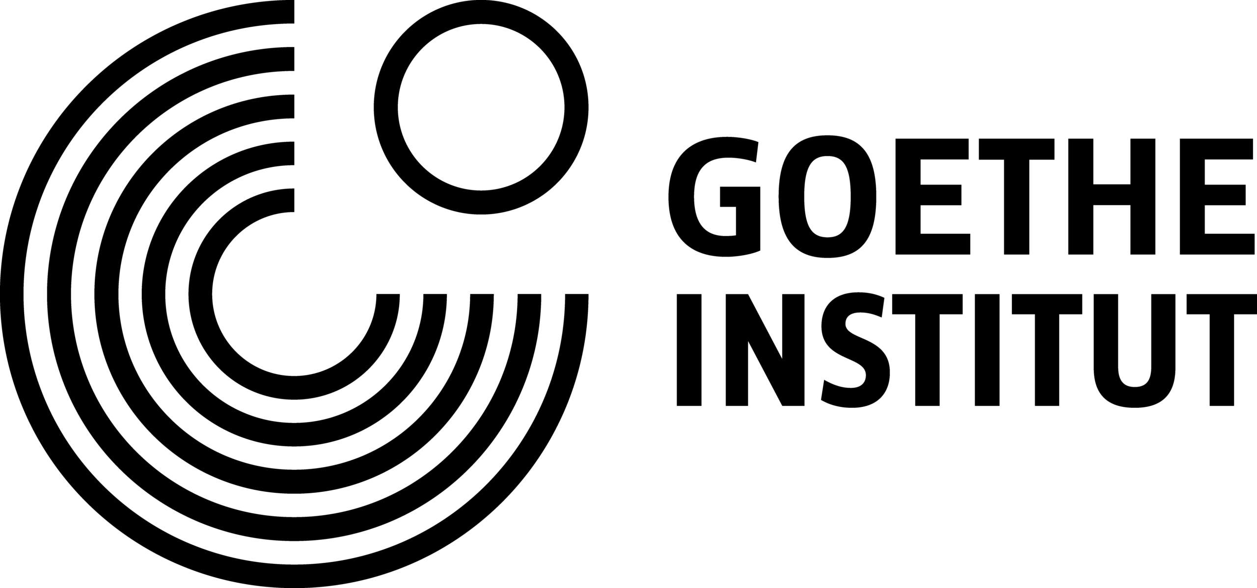 A simple black and white line drawing of a giraffes head and neck, depicted in profile. The giraffe is standing upright and looking to the left, with distinct spots, ossicones, eyes, mouth, and ears visible. The background is white.